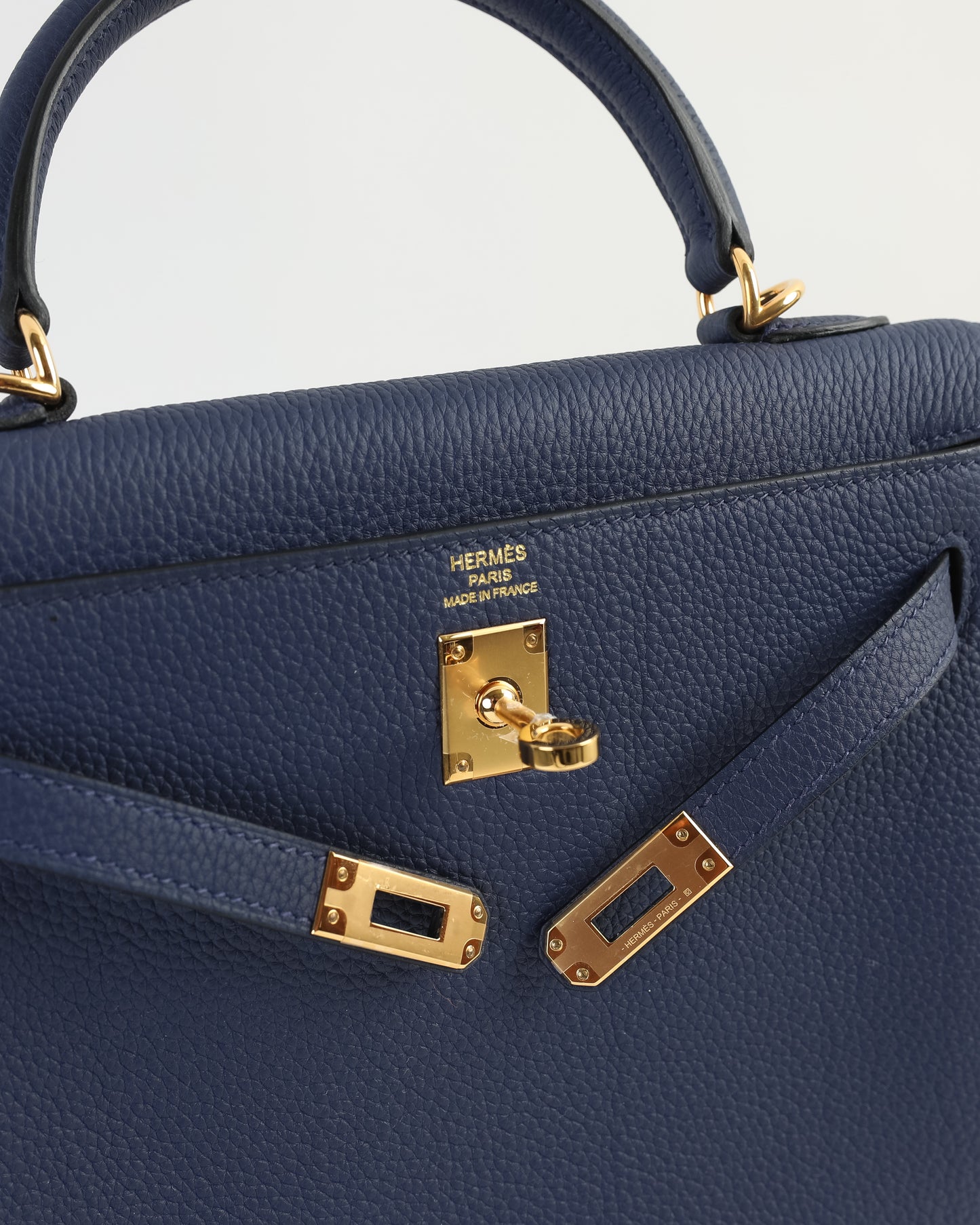 Kelly 25 Bleu Nuit in Togo Leather with Gold Hardware