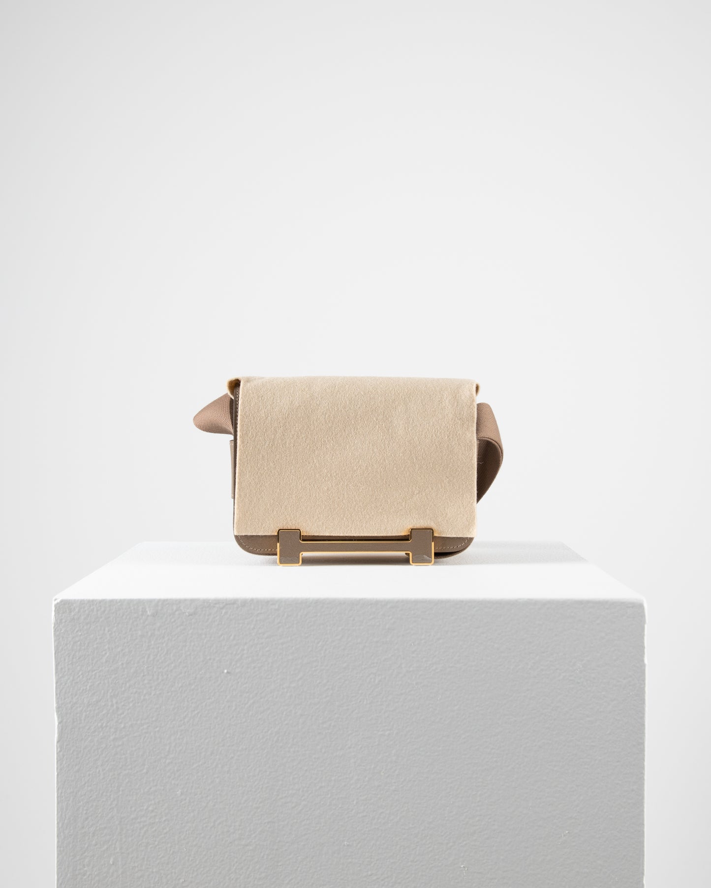 Geta Etoupe in Mysore Goatskin with Canvas Strap and Etoupe/Gold H Buckle