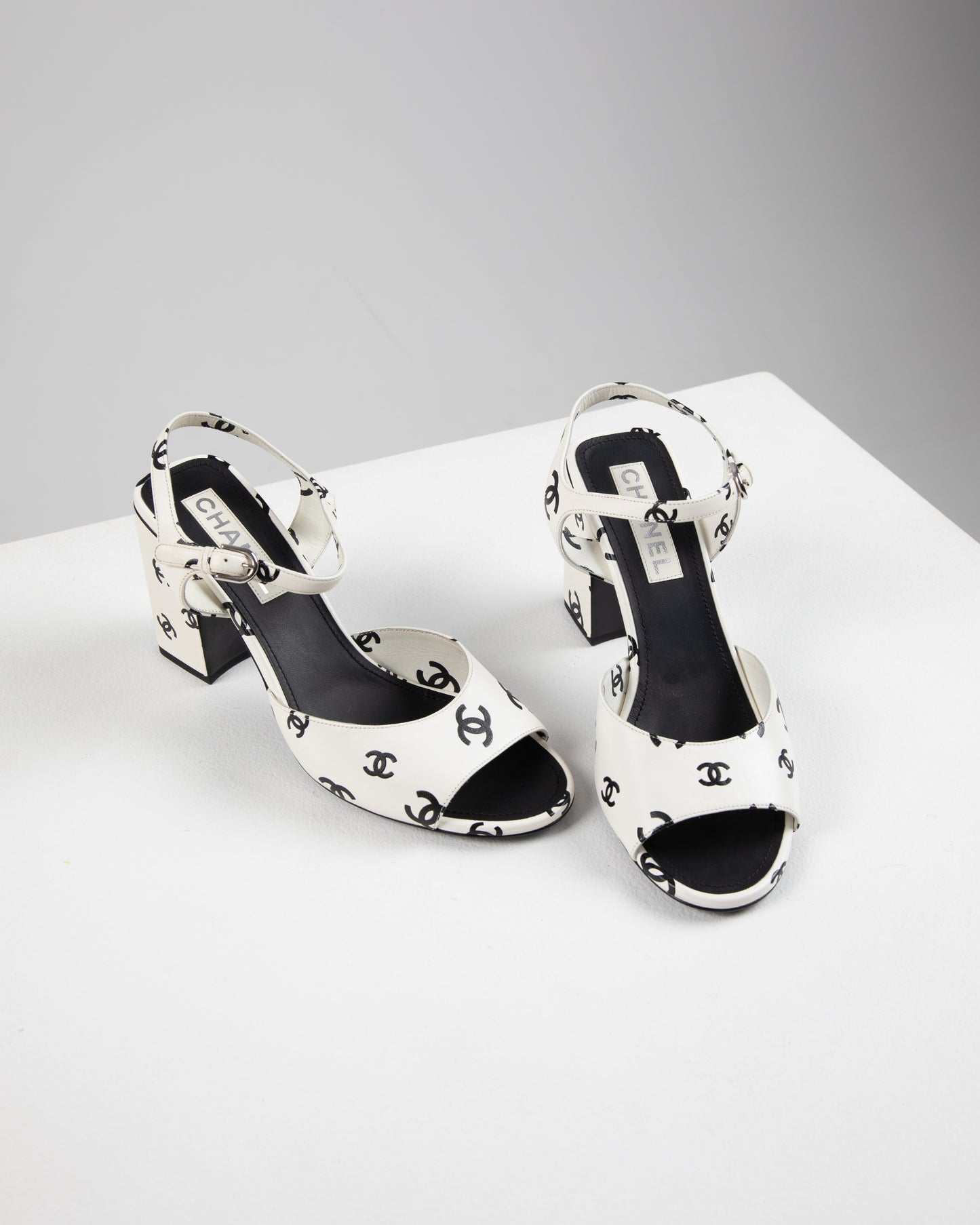 Chanel printed lambskin cc sandals in white