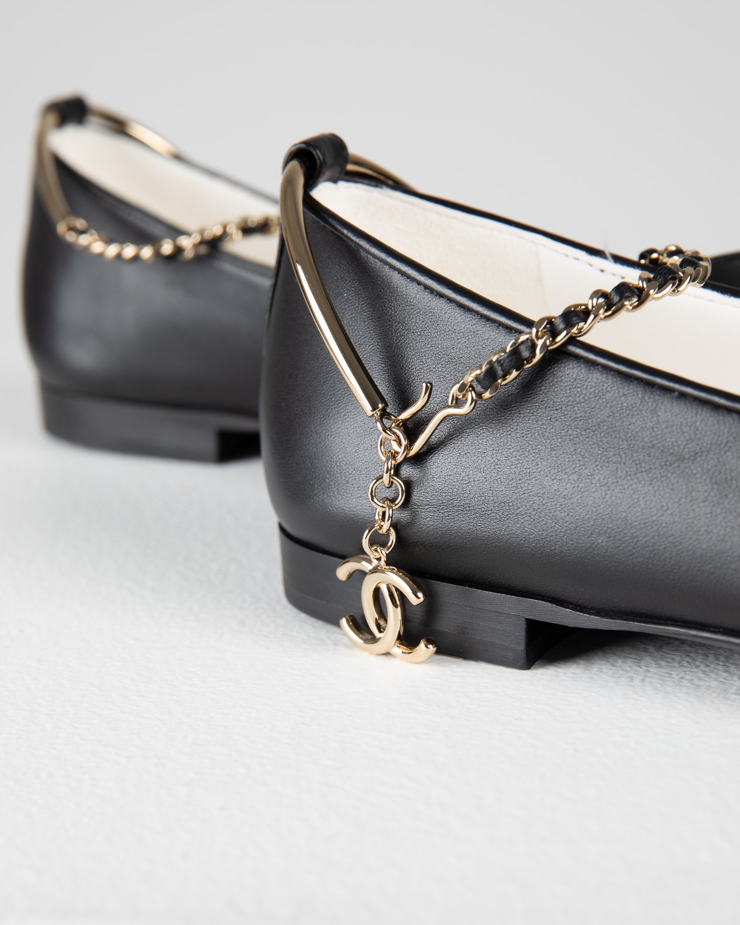 Chanel Ballerina Shoes in Black Leather with Patent Cap Toe and Chain Detail