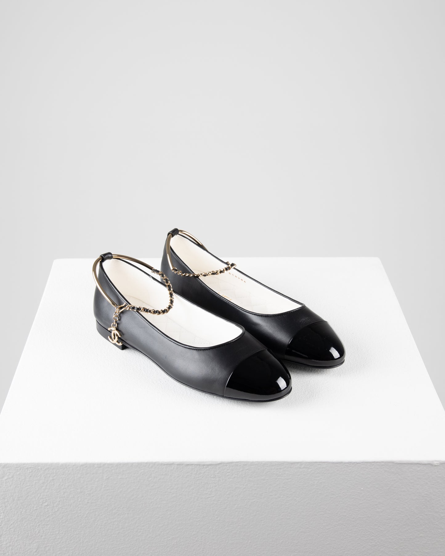 Chanel Ballerina Shoes in Black Leather with Patent Cap Toe and Chain Detail