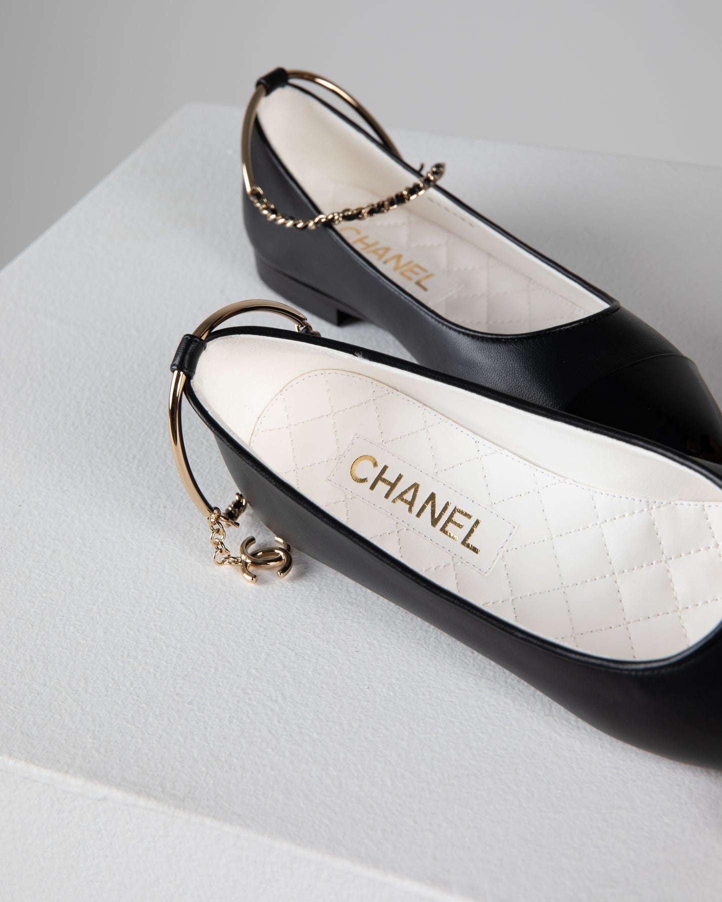 Chanel Ballerina Shoes in Black Leather with Patent Cap Toe and Chain Detail