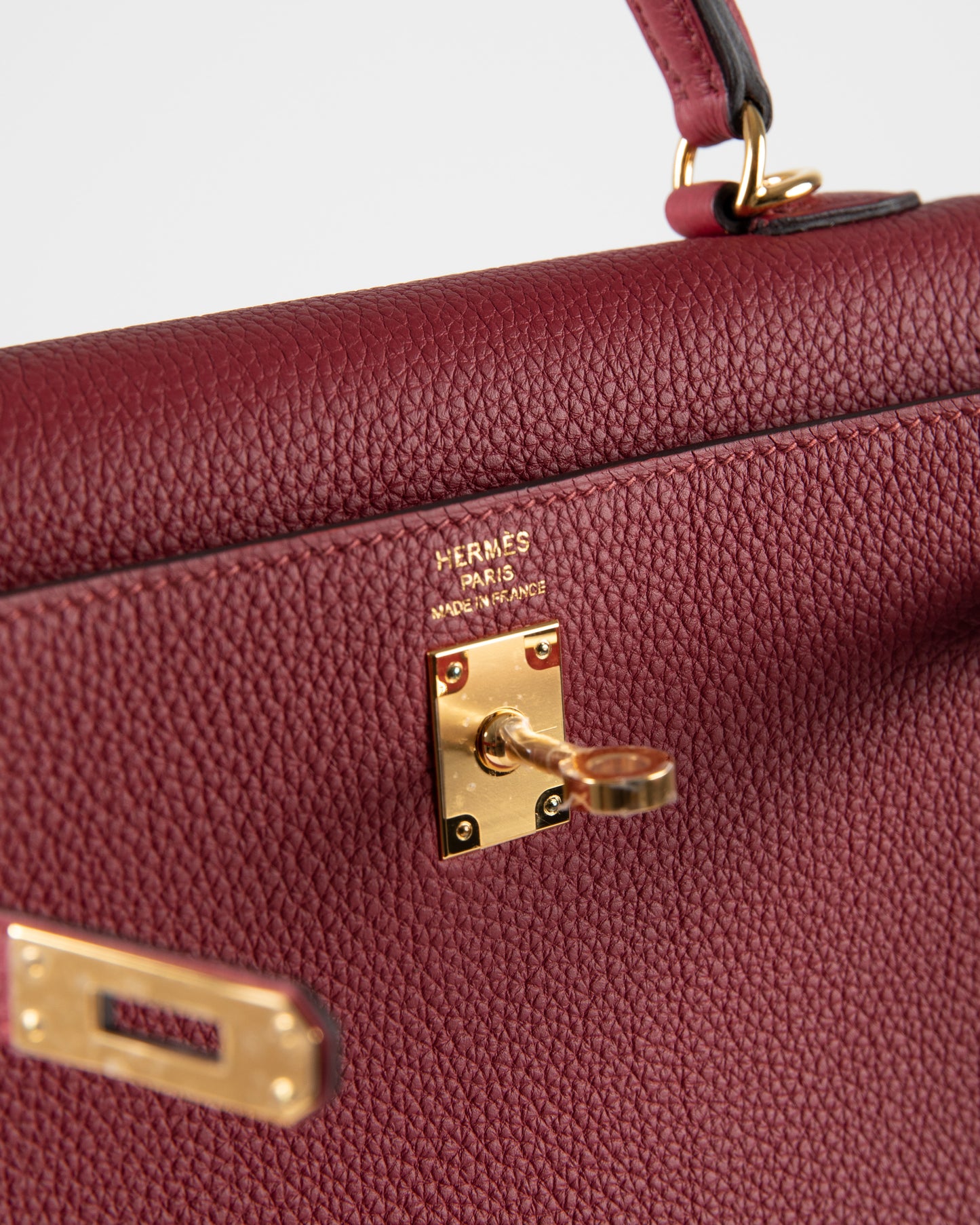 Kelly 25 Rouge Grenat in Togo Leather with Gold Hardware