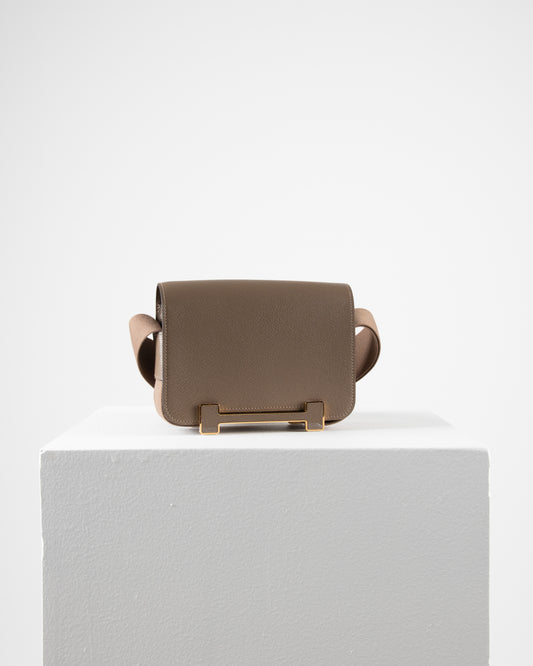 Geta Etoupe in Mysore Goatskin with Canvas Strap and Etoupe/Gold H Buckle