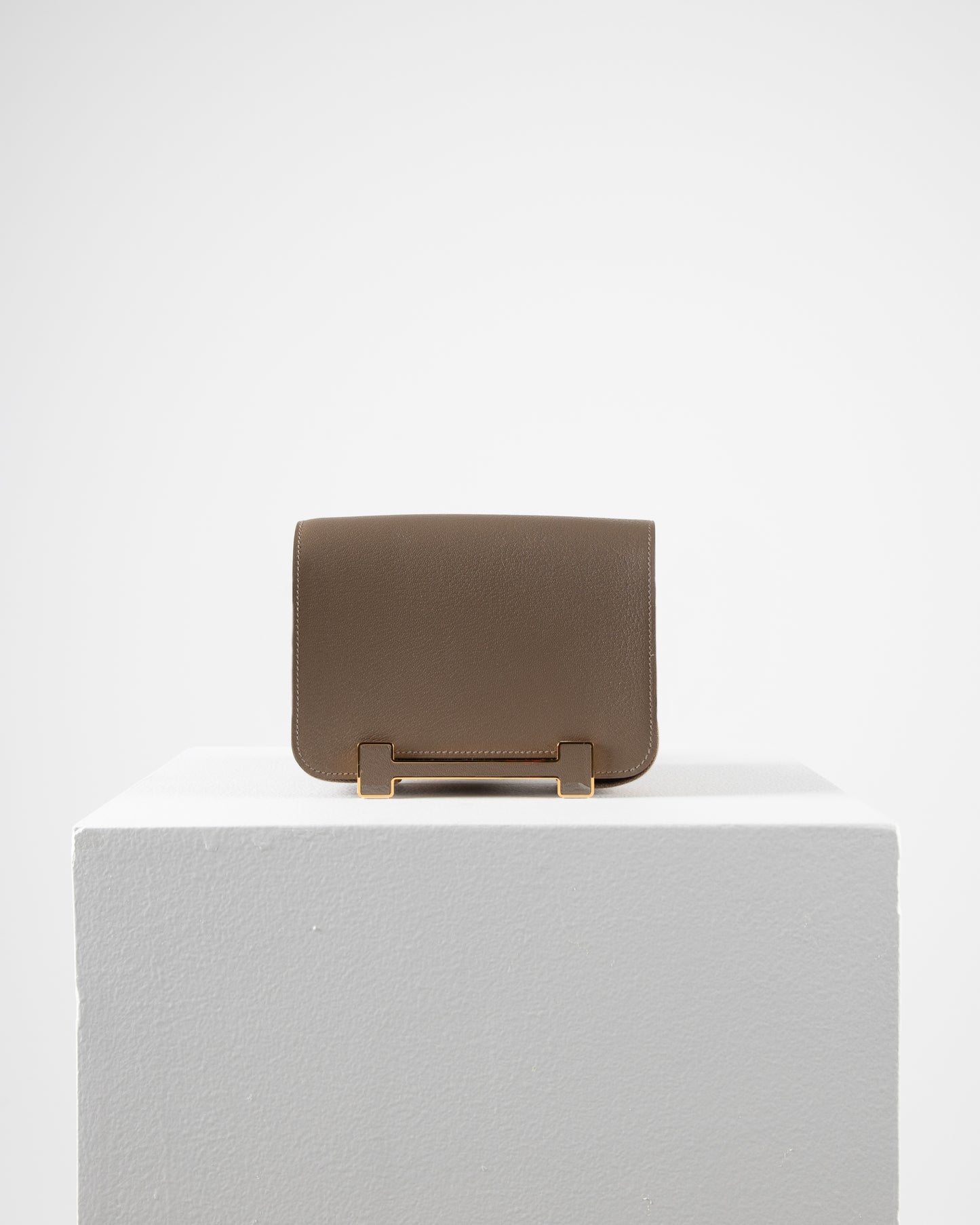 Geta Etoupe in Mysore Goatskin with Canvas Strap and Etoupe/Gold H Buckle