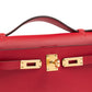 Kelly Pochette Rouge Radieux in Swift Leather with Gold Hardware