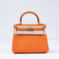 Kelly 25 Orange in Togo Leather with Gold Hardware