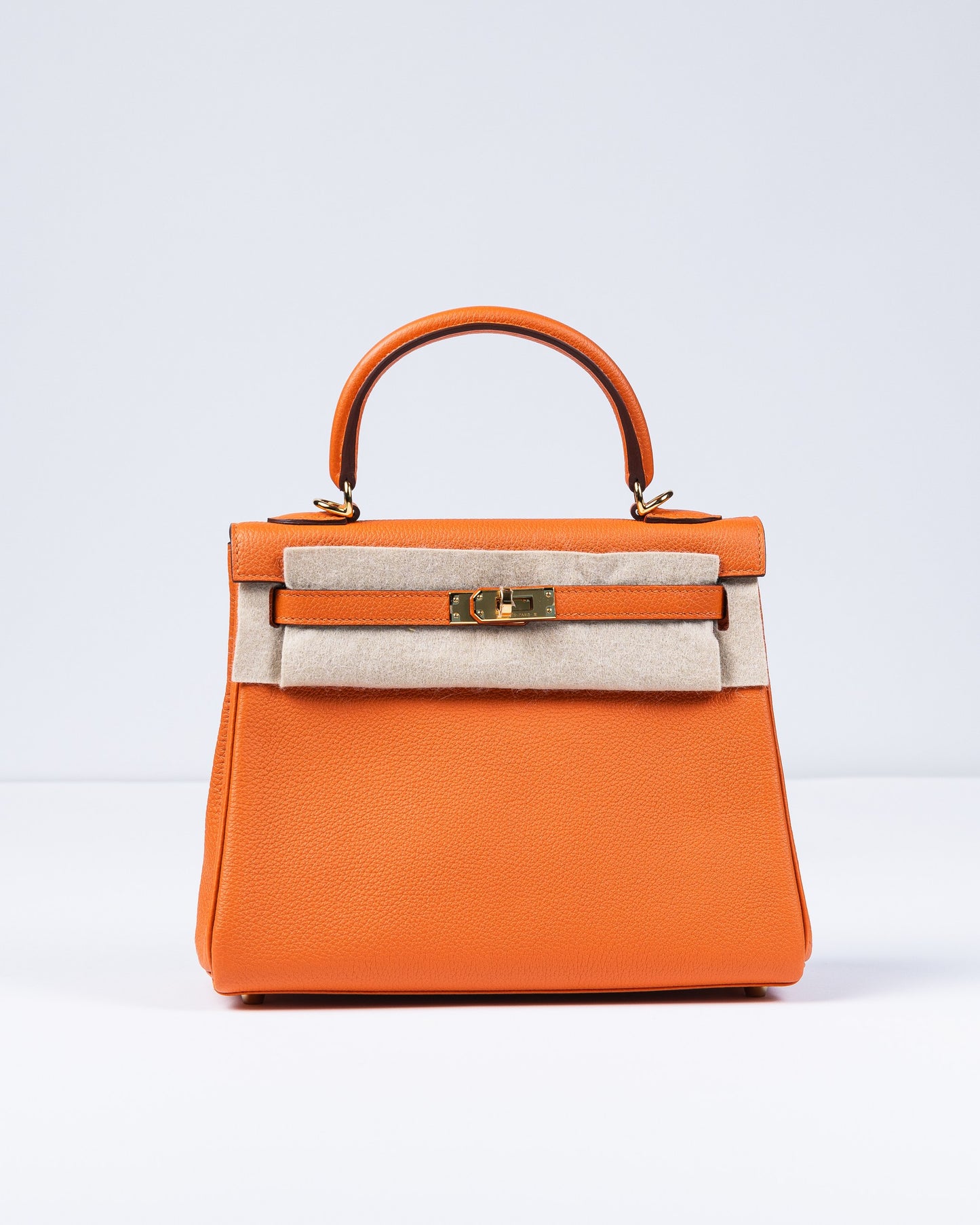 Kelly 25 Orange in Togo Leather with Gold Hardware