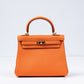 Kelly 25 Orange in Togo Leather with Gold Hardware