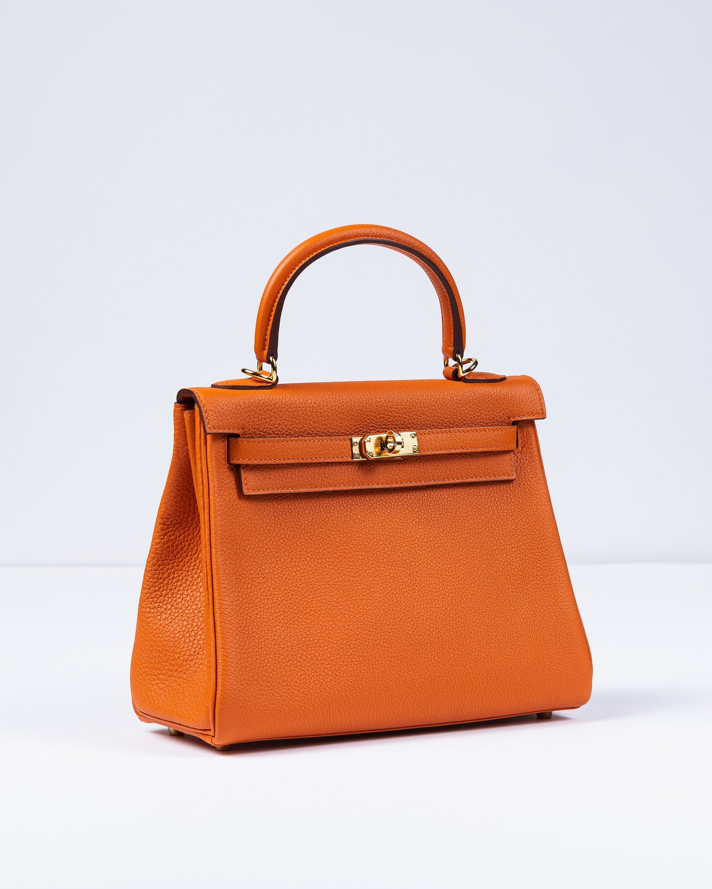 Kelly 25 Orange in Togo Leather with Gold Hardware