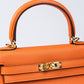 Kelly 25 Orange in Togo Leather with Gold Hardware