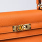 Kelly 25 Orange in Togo Leather with Gold Hardware