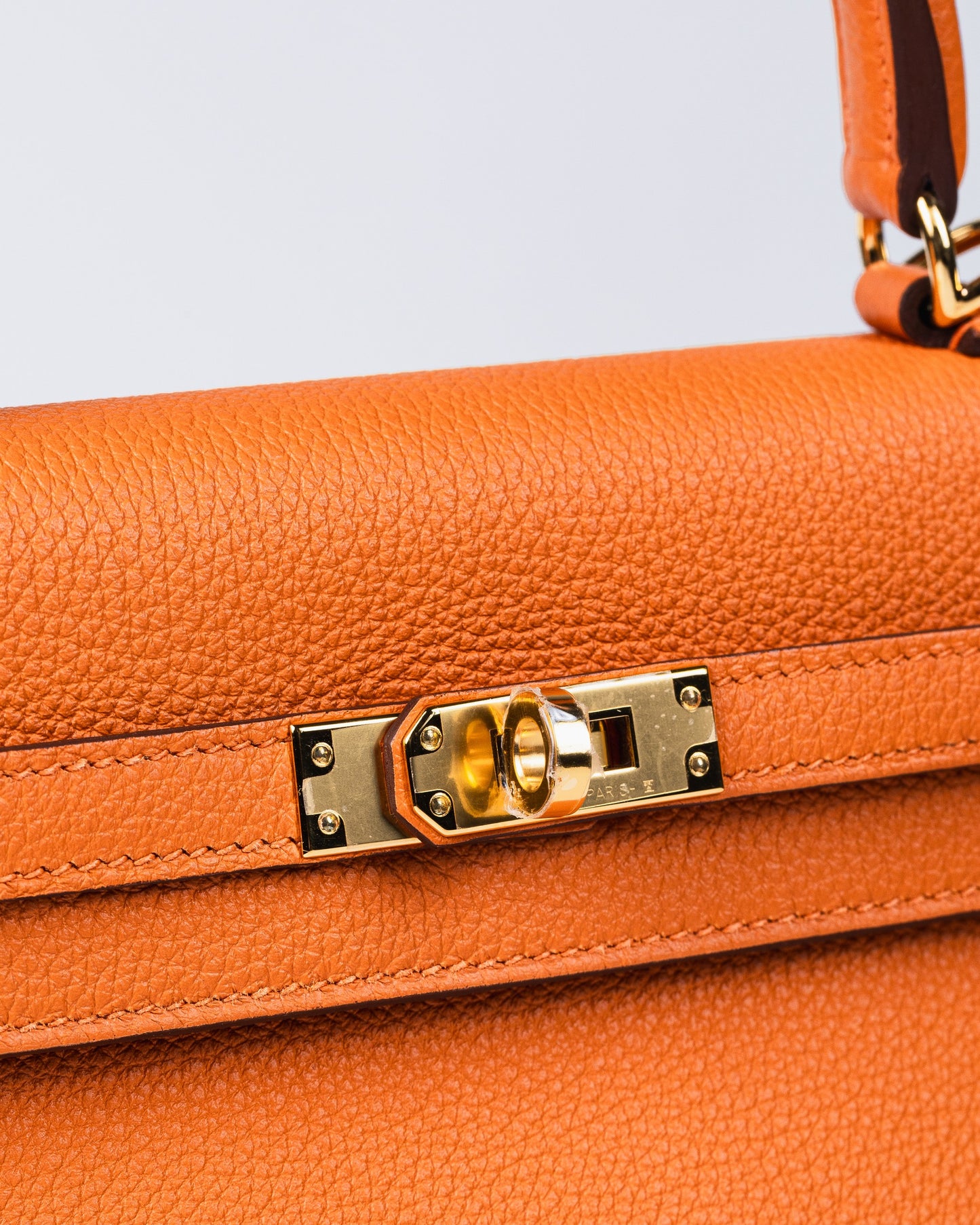 Kelly 25 Orange in Togo Leather with Gold Hardware