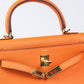 Kelly 25 Orange in Togo Leather with Gold Hardware
