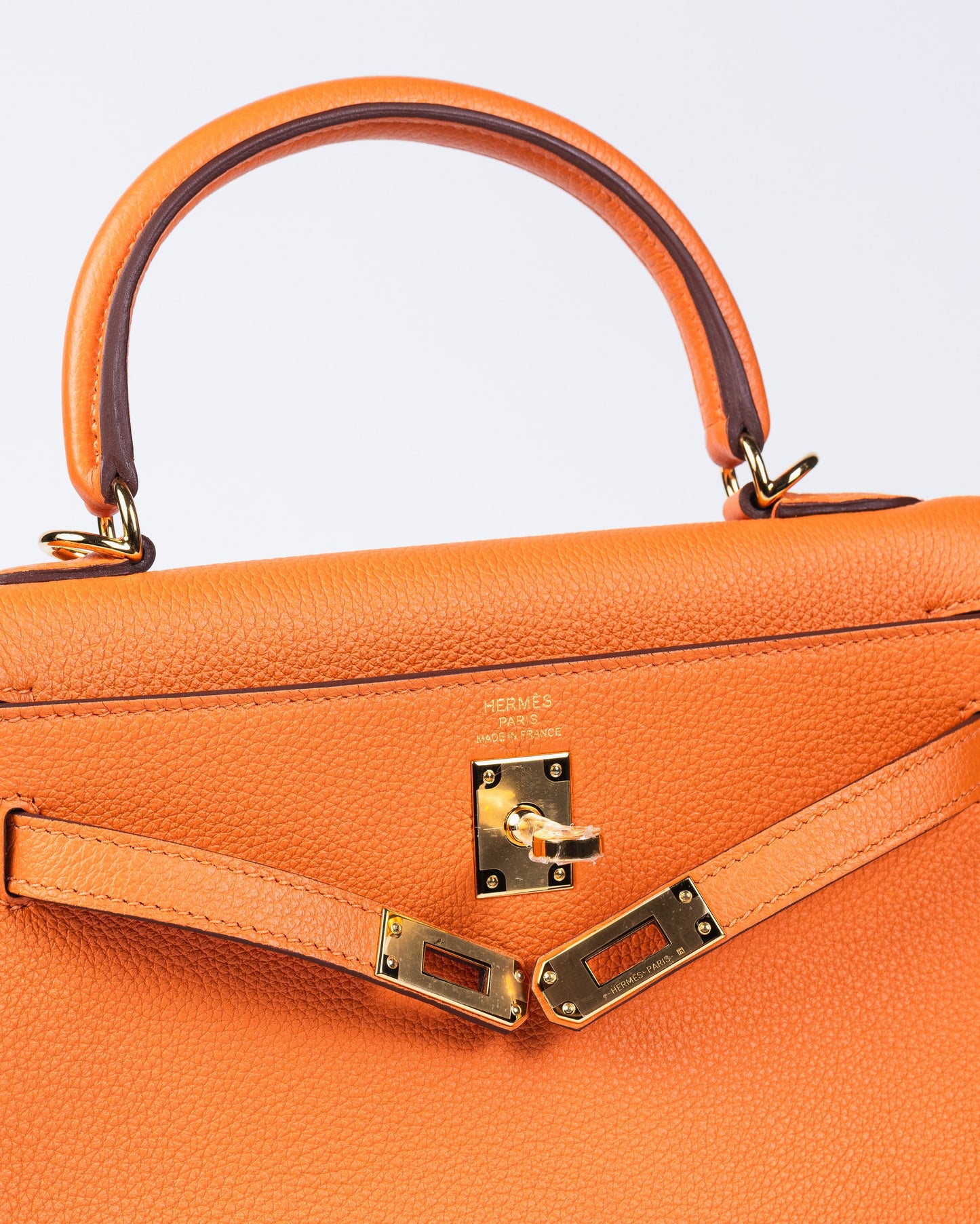 Kelly 25 Orange in Togo Leather with Gold Hardware