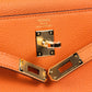 Kelly 25 Orange in Togo Leather with Gold Hardware