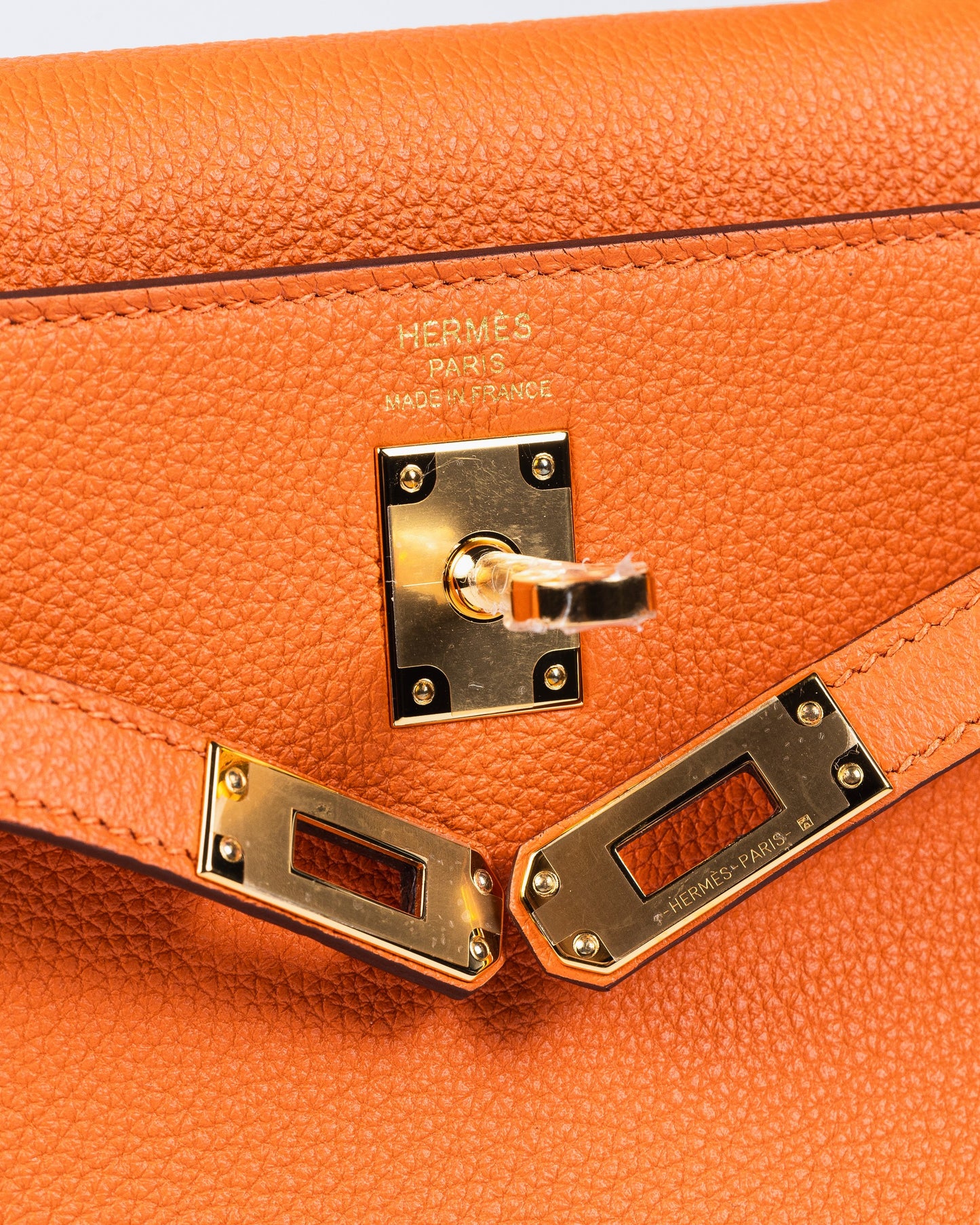 Kelly 25 Orange in Togo Leather with Gold Hardware