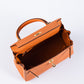 Kelly 25 Orange in Togo Leather with Gold Hardware