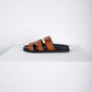 Chypre Sandal in Gold/Black Epsom